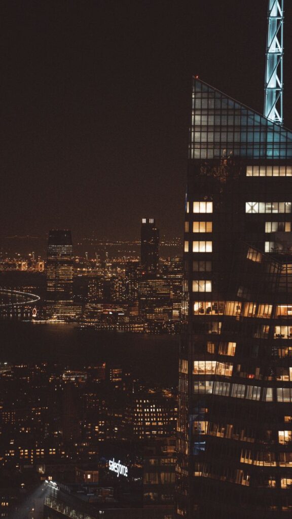 Stunning night skyline of New York City featuring illuminated skyscrapers and vibrant city lights.